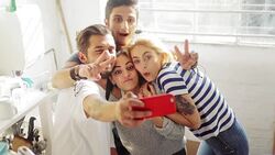 Young couples taking selfie in sunny apartment kitchen Stock Footage