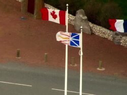 HA MS Canadian, French, and Newfoundland flags outside park at Beaumont Hamel/ Beaumont Hamel, France Stock Footage