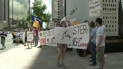 Protesters hold a demonstration against BP while holding banners and signs. Stock Footage