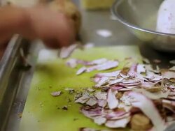 MS Prep cook slicing okra / Truxton's, CA, United States Stock Footage