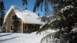 Wooden Cottage, Log Home, Log Cabin in Winter Stock Footage