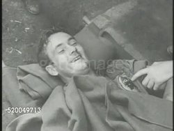 1950: KOREAN WAR: NOT GRAPHIC MS United States Army wounded soldier lying w/ bloody nose. INT VS U.S. & South Korean (ROK) soldiers resting indoors, sleeping. South Korea, 38th Parallel Instructional Video