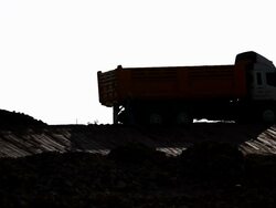 Dump truck on the road at dam Stock Footage