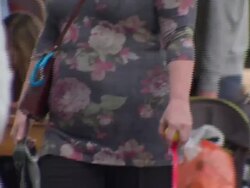 Anonymous obese people walking on streets News Clip