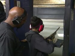 Father Teaches Daughter to Fire a 22 Caliber Rifle Stock Footage