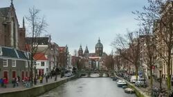 HD time-lapse panning: Amsterdam Canal with Church of Saint Nicholas Stock Footage