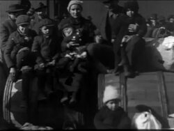 B/W 1900s PORTRAIT immigrant family sitting + posing for camera / NYC / newsreel Stock Footage