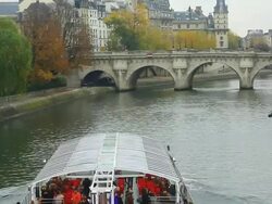 River boat for sightseeing on the Seine river, Pont Neuf, Paris, France Stock Footage