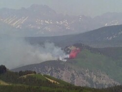 WS Plane flying and dropping fire retardant / Unspecified Stock Footage