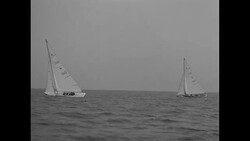 Scenes of small yachts and crew members competing in Chicago Star boat race News Clip