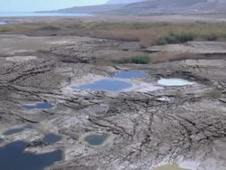 Sinkholes near the Dead Sea, formed by dissolution of underground salt by incoming freshwater, as a result of a continuing sea level drop, Israel, Judea Desert Stock Footage