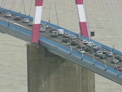 MS AERIAL ZO Shot of Traffic in st Nazaire Bridge / Pais de la Loire, France Stock Footage