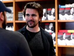 Juanes greets fans and signs copies of his book Stock Footage