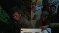 VOICED : Granjeros chinos desplazados por el progreso News Clip