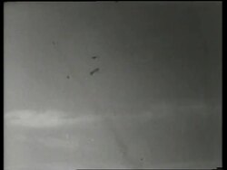 B/W pieces of exploded airplane flying thru air / air show / de Havilland Night Fighter / England / Stock Footage