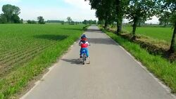 Toddler Learning to ride his new bike Stock Footage