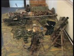 KOSOVO: SERB POLICE DISPLAY ARMS CACHE Instructional Video