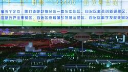 A close up of a brightly lit Chinese diorama with flashing LED lighting and a multi screen LED TV back panel Stock Footage