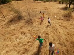 Group of kids playing with paper windmill in the forest Stock Footage