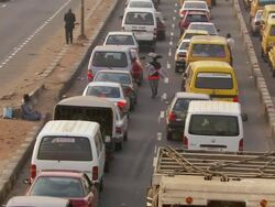 MS Ring road with back of yellow cabs and cards salesman / Lagos, Nigeria Stock Footage