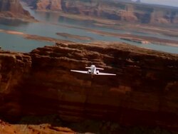 Aerial rear view private jet flying through Grand Canyon / Arizona Stock Footage