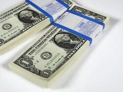 CU SLO MO Shot of Wads of 1 US Dollar Banknotes falling against White Background / Calvados, Normandy, France Stock Footage