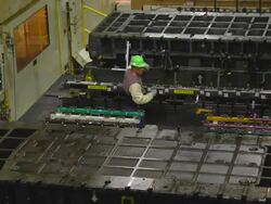 MS ZI PAN Overhead Two workers preparing to moving dies from stamping presses in an auto assembly plant / Princeton, Indiana, United States Stock Footage