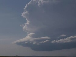 Super cell thunderstorm over open prarie zooms out from close up of clouds, USA Stock Footage