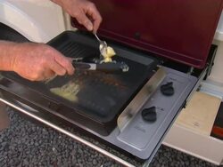 CU Shot of man Crayfish cooked on campervan / Kaikoura, Canterbury, New Zealand Stock Footage