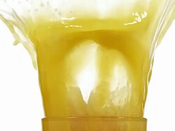 MS SLO MO Orange being Fallen into glass of orange / Vieux Pont, Normandy,  France Stock Footage