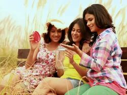 Three young women holding jar in the forest Stock Footage