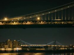 MS TL Night view of Williamsburg Bridge looking south toManhattan Bridge / New York, New York, USA Stock Footage