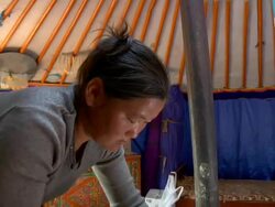CU Nomad woman making cheese in yurt / Central-south Mongolia, Central-south Mongolia, Mongolia Stock Footage