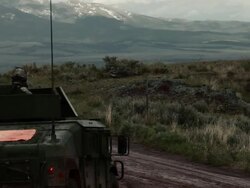 Humvee on a dirt road amid training explosives. Stock Footage