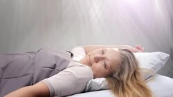 People waking up - Young woman opens her eyes on a sunny morning Stock Footage