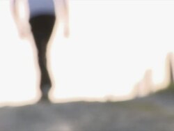 MS SLO MO Man walking into light / RÃŒ_dersdorf, Brandenburg, Germany Stock Footage