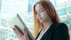 City girl, using digital tablet, outdoors. Stock Footage