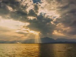 Clouds and sunbeams on Kwan Phayao Lake,Time Lapse Stock Footage