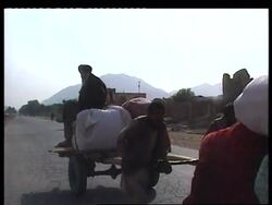 VOICED: Afghanis prepare for possible US attack on capital. News Clip
