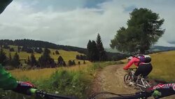 Point of view pedalling on mountainbike with girl Stock Footage