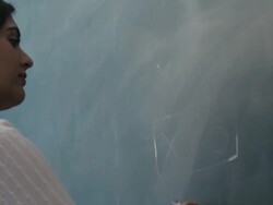 MS Young woman writing mathematical formula on blackboard / Singapore Stock Footage