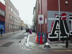 WS PAN East London backstreets and graffiti art of 'ANTI' logo on wall, Shoreditch / London, Greater London, UK Stock Footage