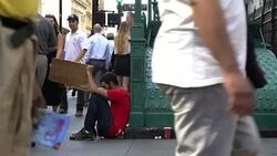 Homeless On Wall Street - Young Man Stock Footage