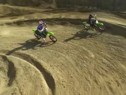 HD CRANE: MX Riders Speeding At The Apex Stock Footage