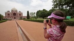 POV of young girl taking photo of ancient building. Stock Footage