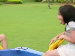 Boy and girl swinging in a Seesaw Stock Footage