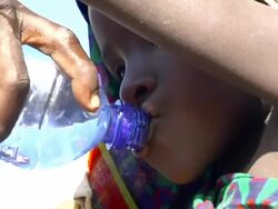 Child drinks water from water bottle Stock Footage