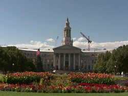 Long Shot static - Flowers bloom on the front lawn of the Denver City and County Building. / Denver, Colorado, USA Stock Footage