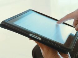 Hands operating a tablet Stock Footage