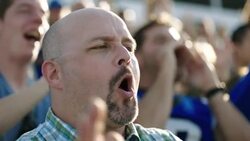 Stadium crowd, excited fan cheers at football game Stock Footage